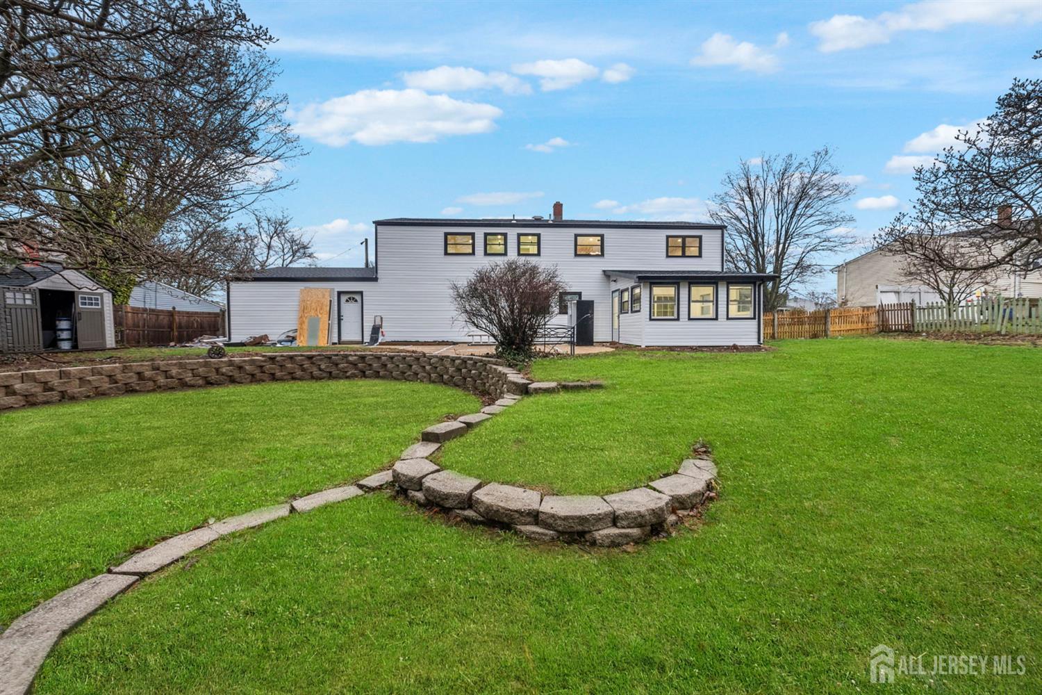 12 Barker Road Somerset, NJ 08873 - Photo 34 of 43 a view of a house with a yard porch and sitting area