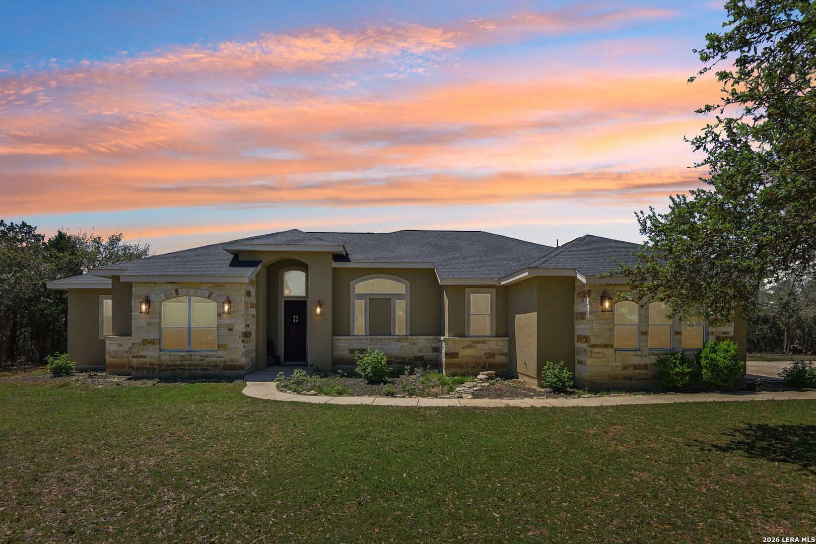 345 Ridge Point Spring Branch, TX 78070 - Photo 1 of 48 a front view of house with yard and green space
