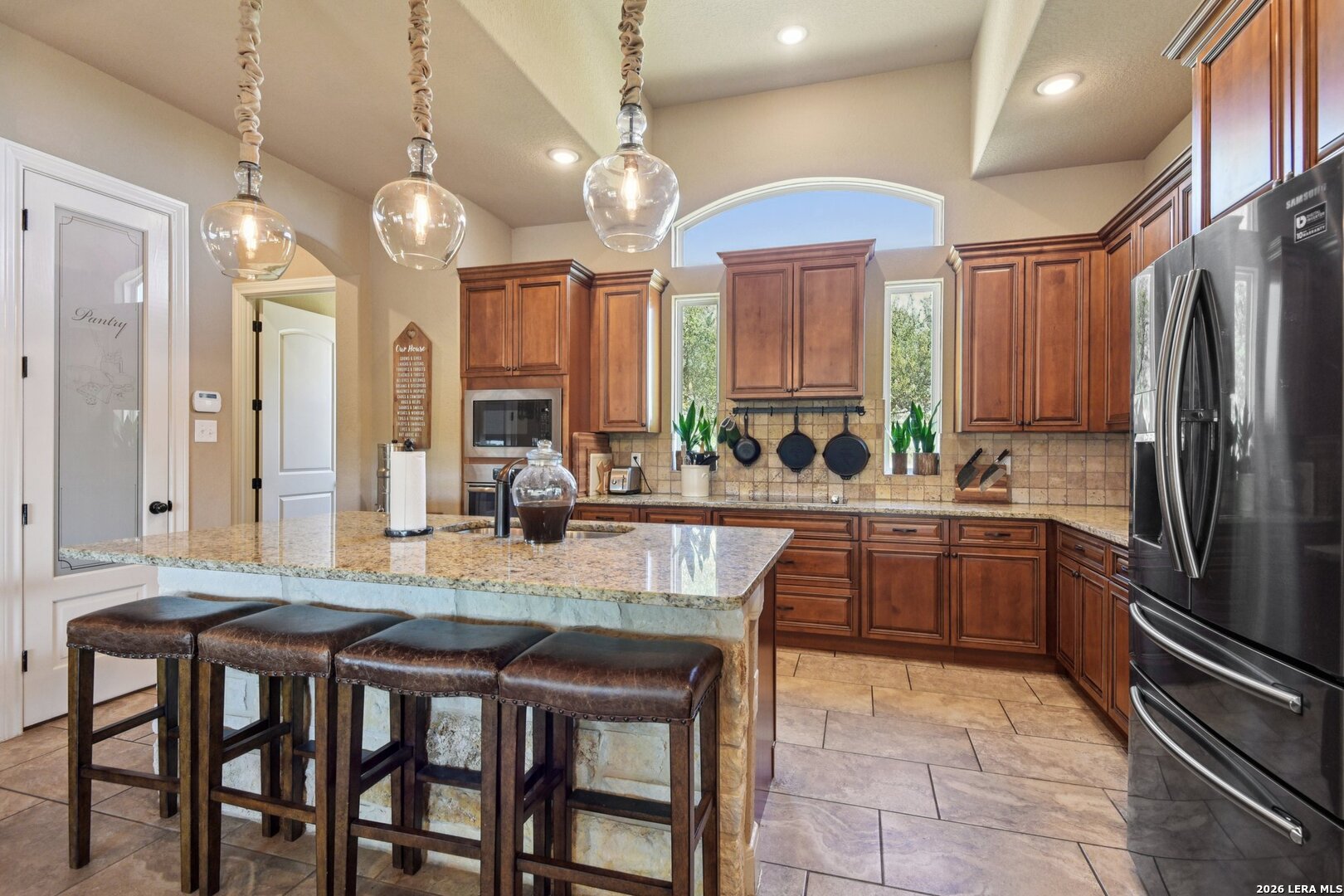 345 Ridge Point Spring Branch, TX 78070 - Photo 14 of 48 a kitchen with stainless steel appliances granite countertop a sink refrigerator and cabinets