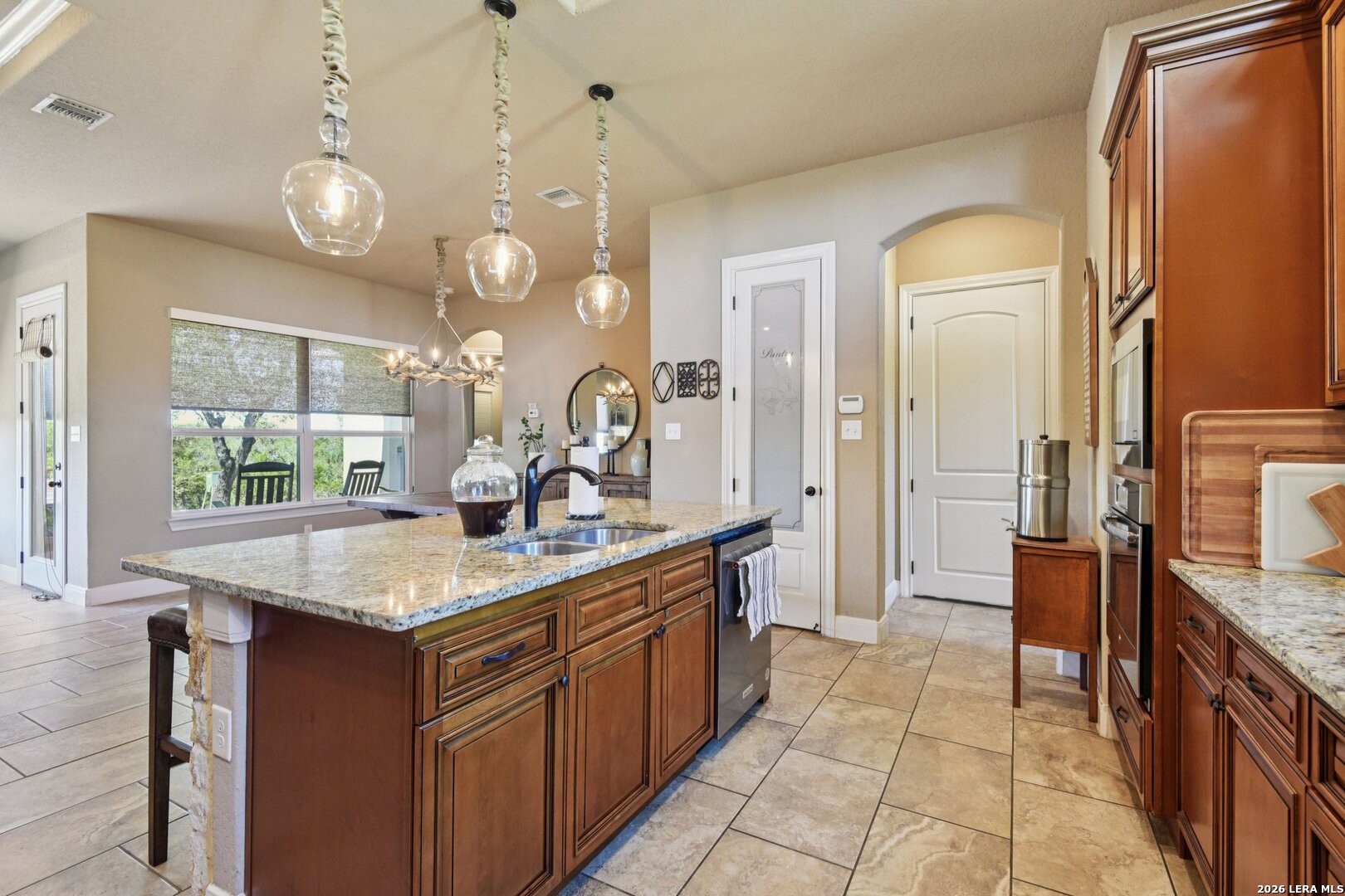 345 Ridge Point Spring Branch, TX 78070 - Photo 18 of 48 a kitchen with a refrigerator a sink and dishwasher