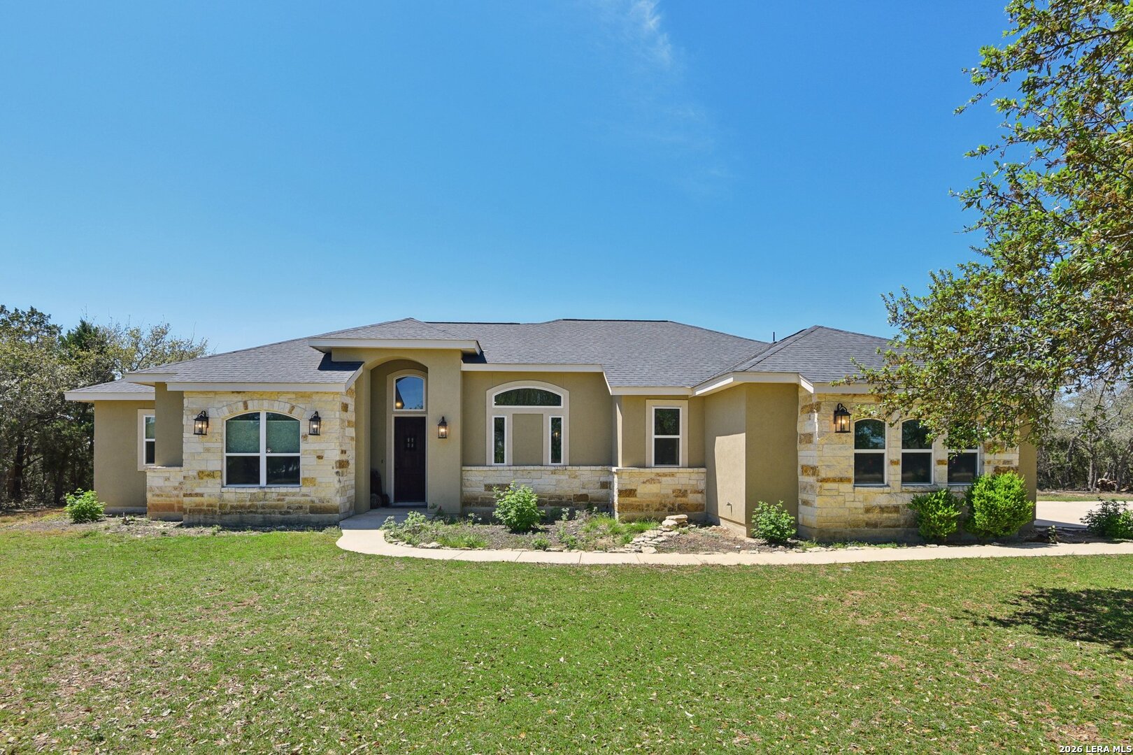 345 Ridge Point Spring Branch, TX 78070 - Photo 2 of 48 a front view of house with yard and green space