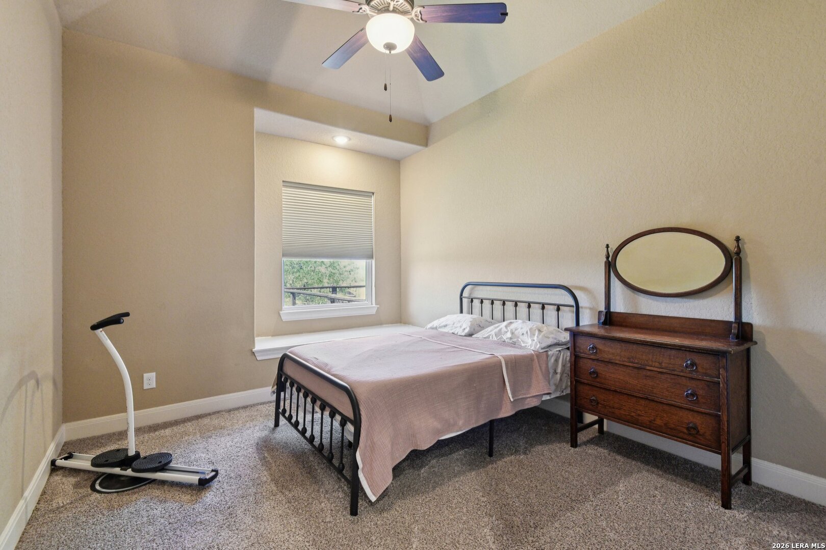 345 Ridge Point Spring Branch, TX 78070 - Photo 26 of 48 a bedroom with a bed and a chandelier