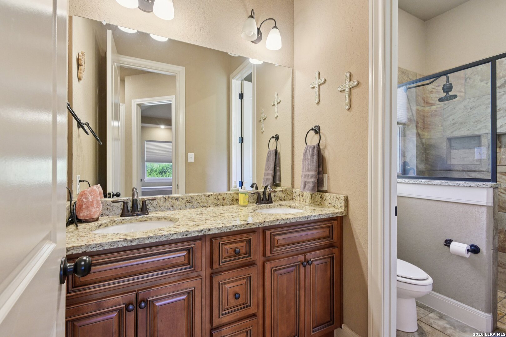 345 Ridge Point Spring Branch, TX 78070 - Photo 32 of 48 a bathroom with a granite countertop sink toilet and shower