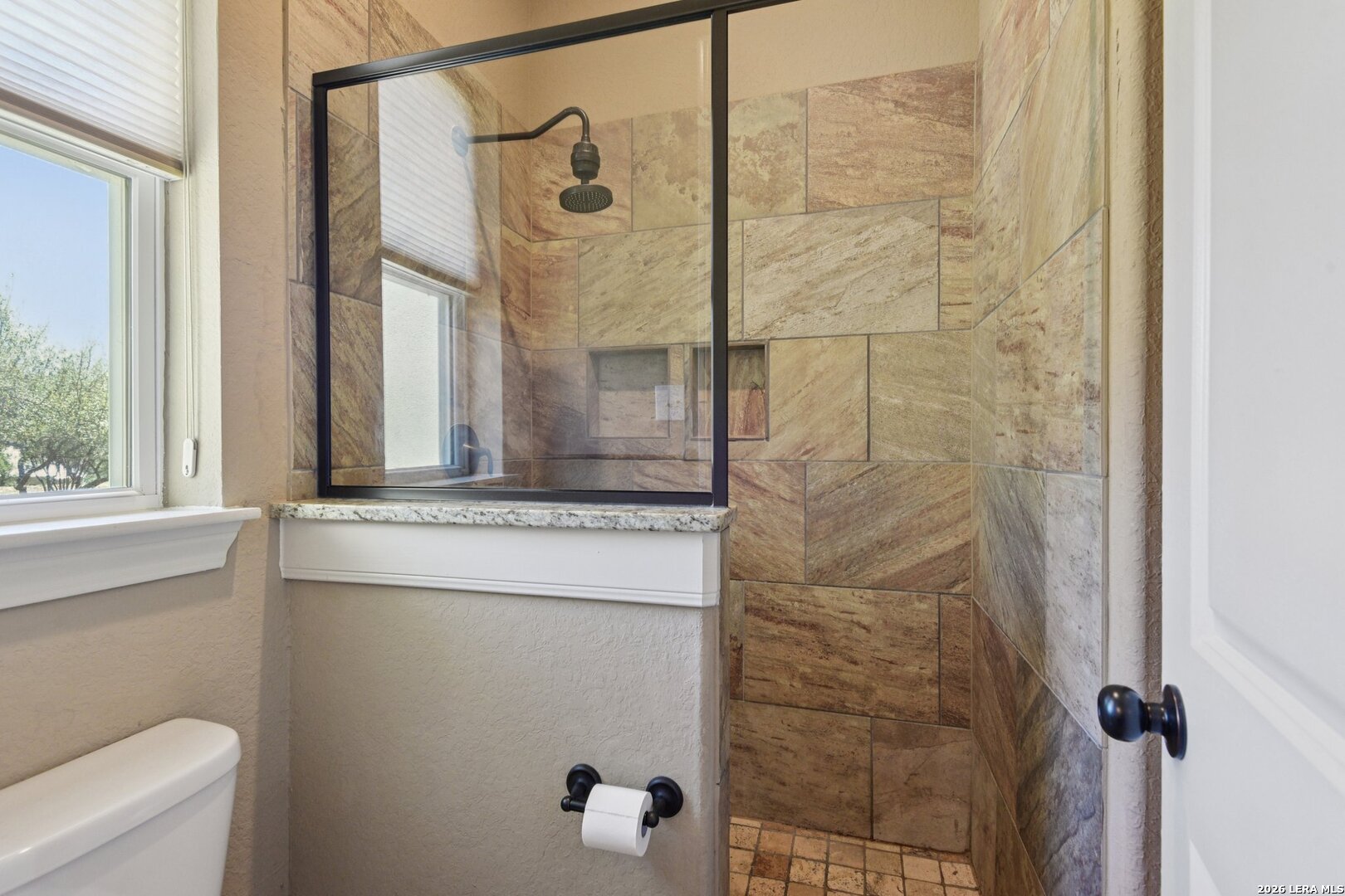 345 Ridge Point Spring Branch, TX 78070 - Photo 33 of 48 a bathroom with a granite countertop sink a toilet and shower
