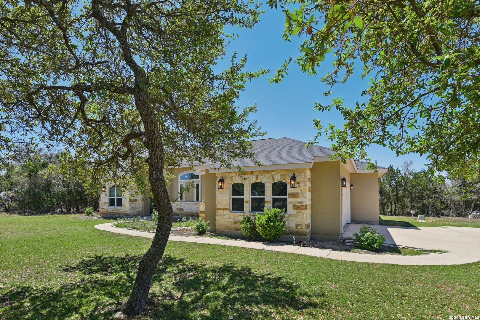 345 Ridge Point Spring Branch, TX 78070 - Photo 6 of 48 a front view of a house with a yard