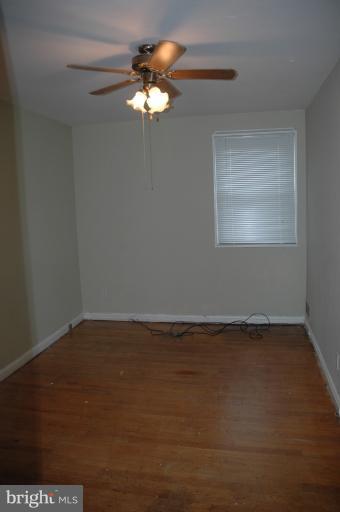 4170 Crest Heights Road Baltimore, MD 21215 - Photo 14 of 30 a view of an empty room with a window