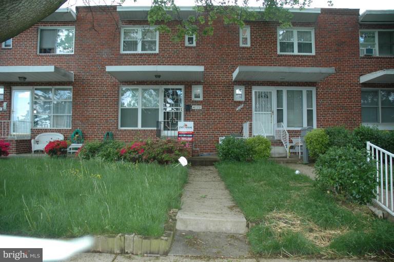 4170 Crest Heights Road Baltimore, MD 21215 - Photo 16 of 30 a front view of a house having yard