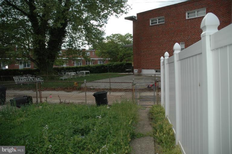 4170 Crest Heights Road Baltimore, MD 21215 - Photo 18 of 30 a backyard of a house with lots of green space