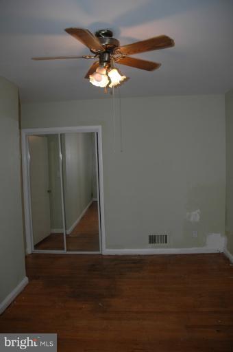 4170 Crest Heights Road Baltimore, MD 21215 - Photo 3 of 30 a view of wooden floor and chandelier in a room