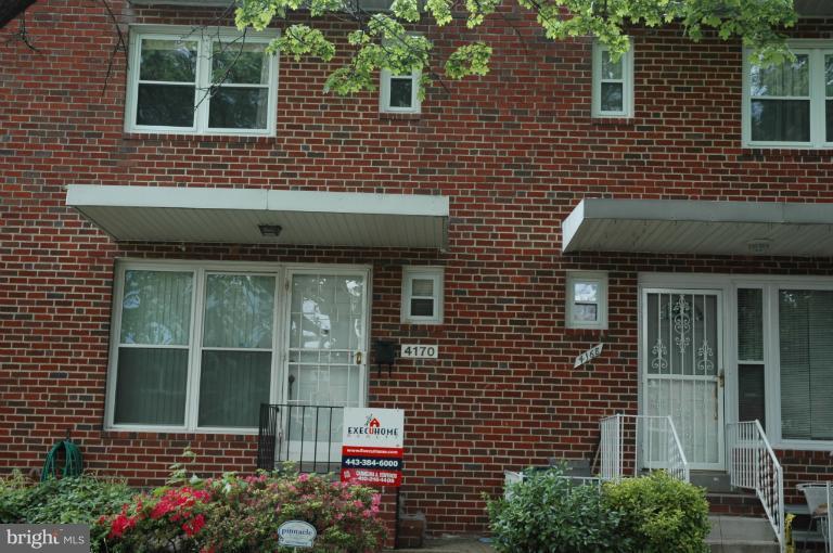 4170 Crest Heights Road Baltimore, MD 21215 - Photo 21 of 30 a front view of a house with a garden