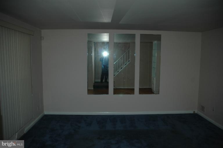 4170 Crest Heights Road Baltimore, MD 21215 - Photo 27 of 30 a view of wooden floor and a window in a room