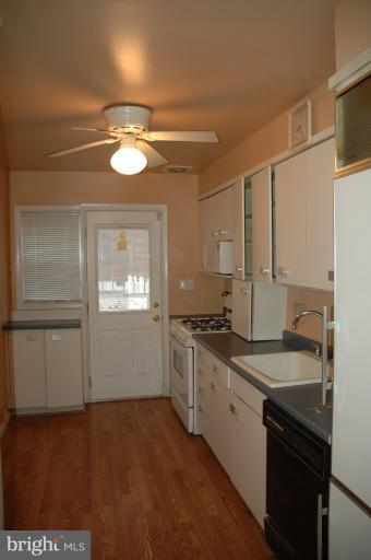 4170 Crest Heights Road Baltimore, MD 21215 - Photo 29 of 30 a kitchen with a stove and a refrigerator