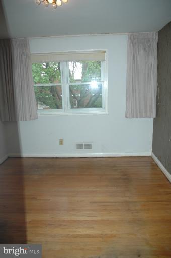 4170 Crest Heights Road Baltimore, MD 21215 - Photo 8 of 30 a view of wooden floor and windows in a room