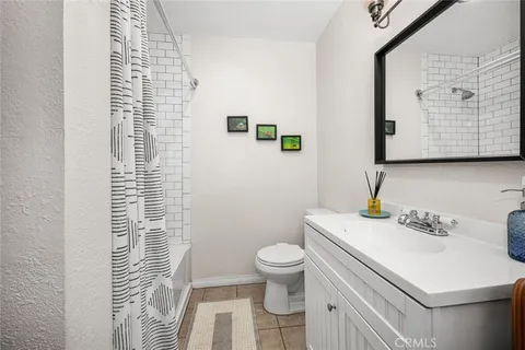 a bathroom with a sink toilet and vanity
