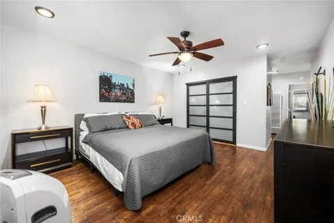 a spacious bedroom with a bed and a window