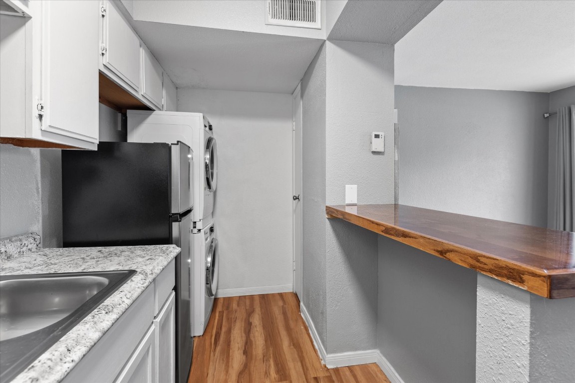 13151 Walden Road, Unit 172 Montgomery, TX 77356 - Photo 11 of 19 a kitchen with a sink and a refrigerator