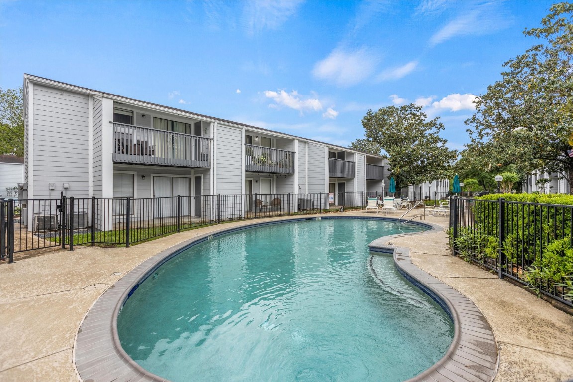 13151 Walden Road, Unit 172 Montgomery, TX 77356 - Photo 19 of 19 a view of a swimming pool with a patio