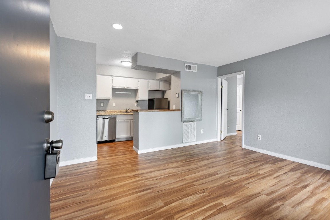 13151 Walden Road, Unit 172 Montgomery, TX 77356 - Photo 4 of 19 a view of kitchen with wooden floor