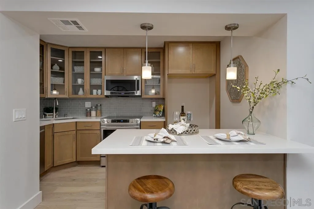 940 Sealane Drive, Unit 6 Encinitas, CA 92024 - Photo 11 of 24 a kitchen with a sink cabinets and appliances