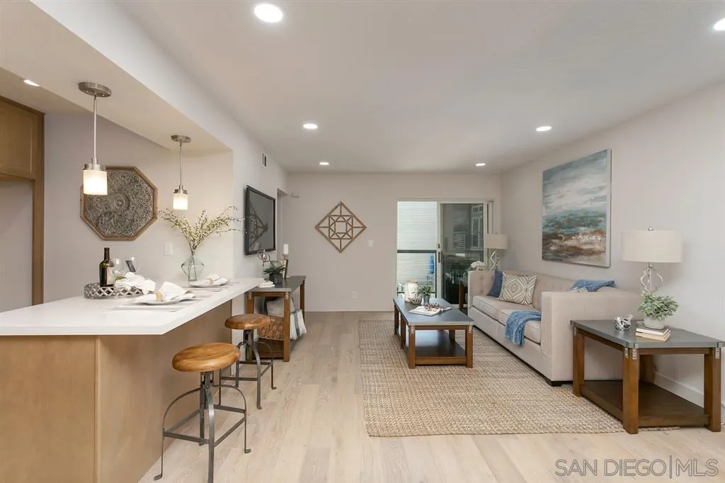 940 Sealane Drive, Unit 6 Encinitas, CA 92024 - Photo 3 of 24 a living room with furniture kitchen view and a wooden floor