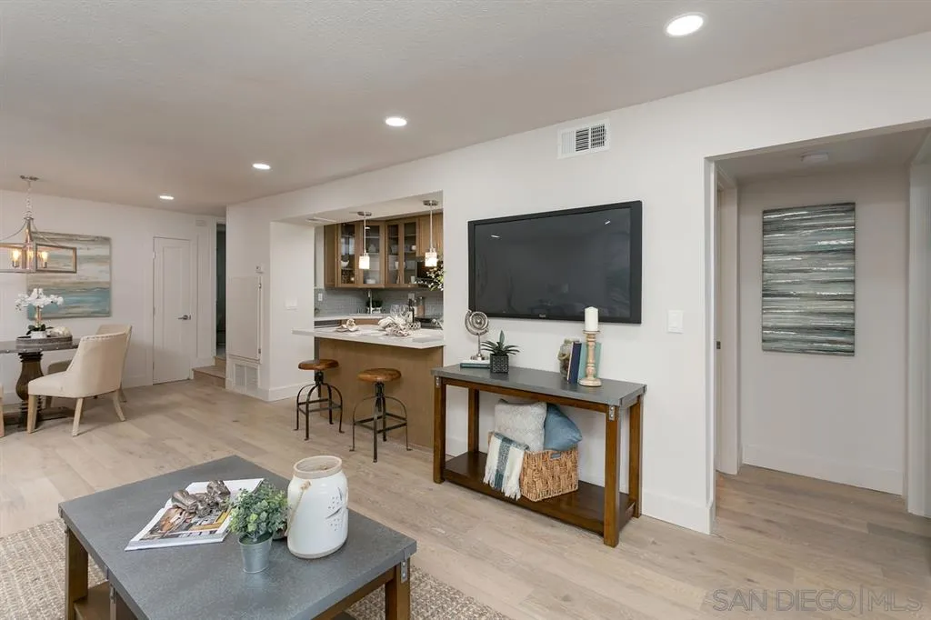 940 Sealane Drive, Unit 6 Encinitas, CA 92024 - Photo 9 of 24 a living room with furniture and a flat screen tv