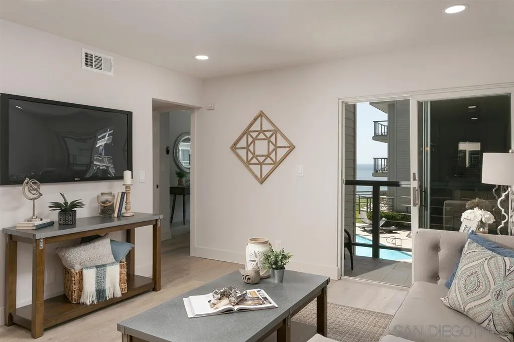 940 Sealane Drive, Unit 6 Encinitas, CA 92024 - Photo 10 of 24 a living room with furniture and a flat screen tv