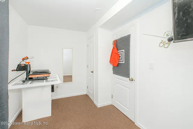 a room with a white cabinets and washer
