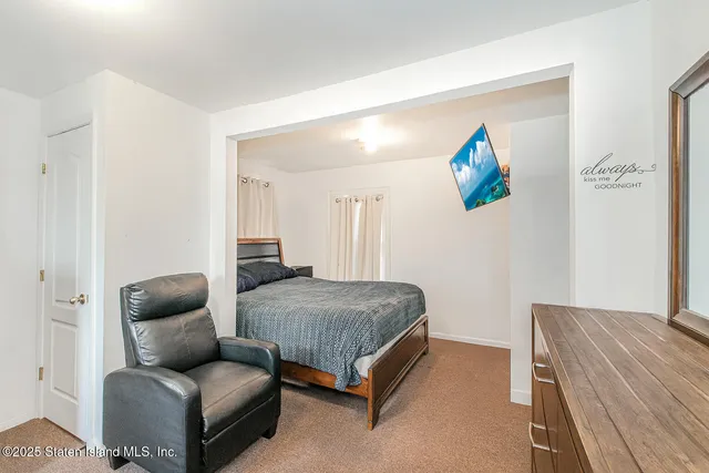 a bedroom with a couch and a couch