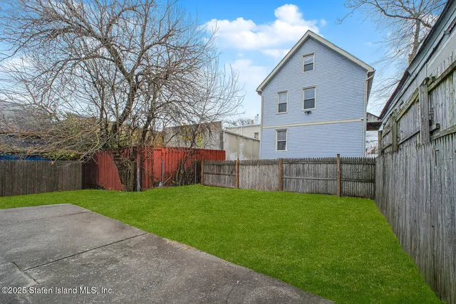 a view of backyard with green space