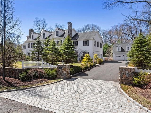 17 White Birch Ridge Weston, CT 06883 - Photo 1 of 1 a front view of a house with a yard and a garden