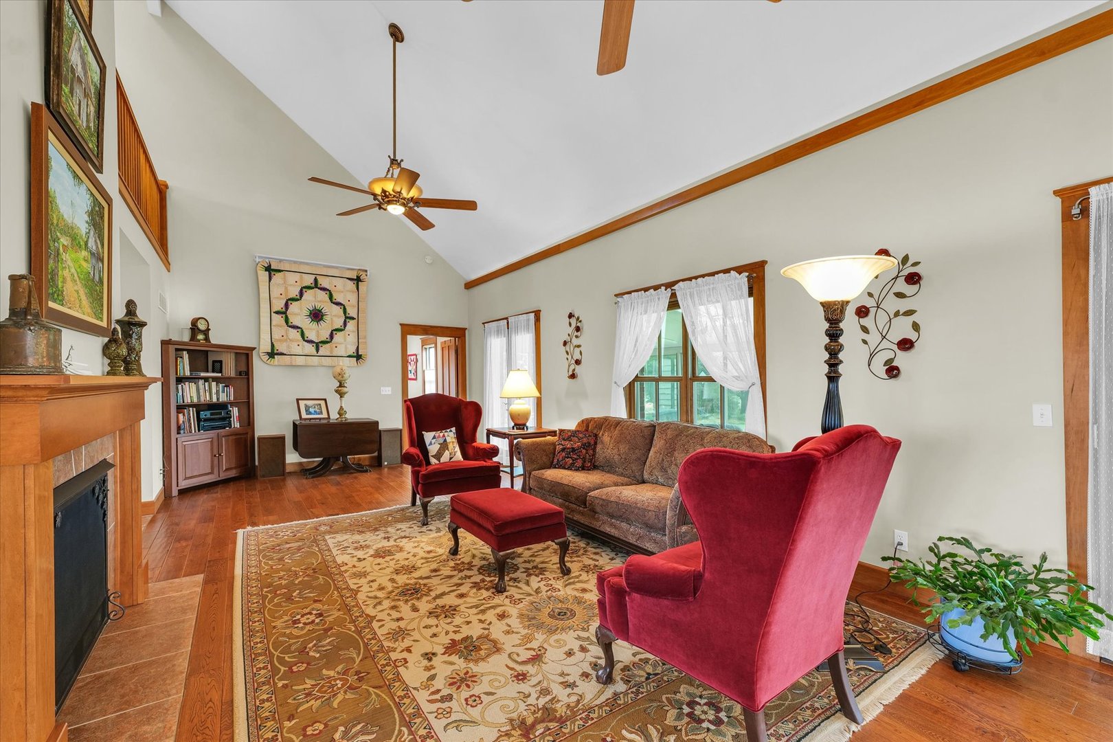 647 County Farm Road Monticello, IL 61856 - Photo 12 of 74 a living room with furniture a fireplace and a chandelier
