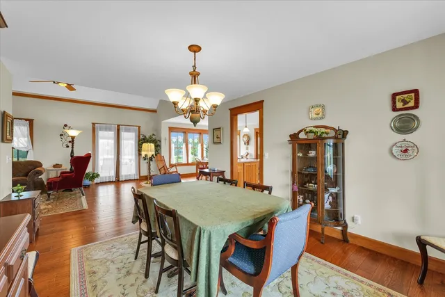 a living room with patio furniture and a floor to ceiling window