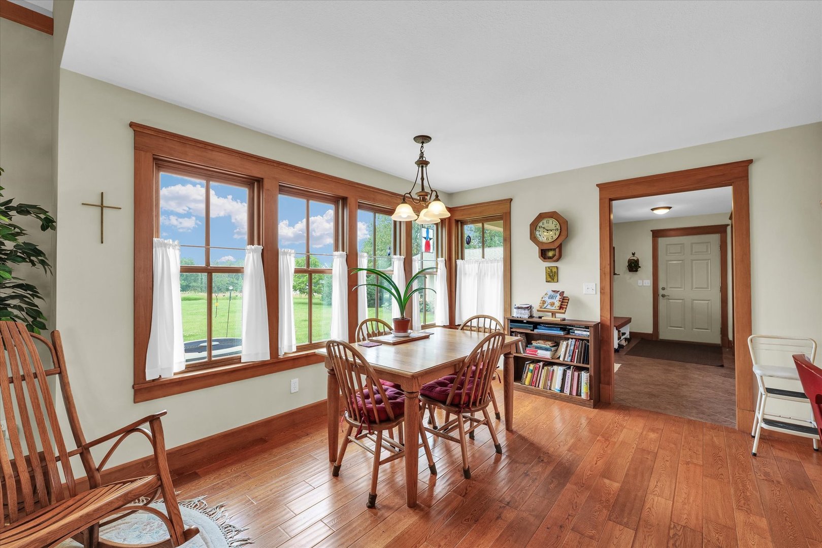 647 County Farm Road Monticello, IL 61856 - Photo 15 of 74 a view of a dining room with furniture window and wooden floor