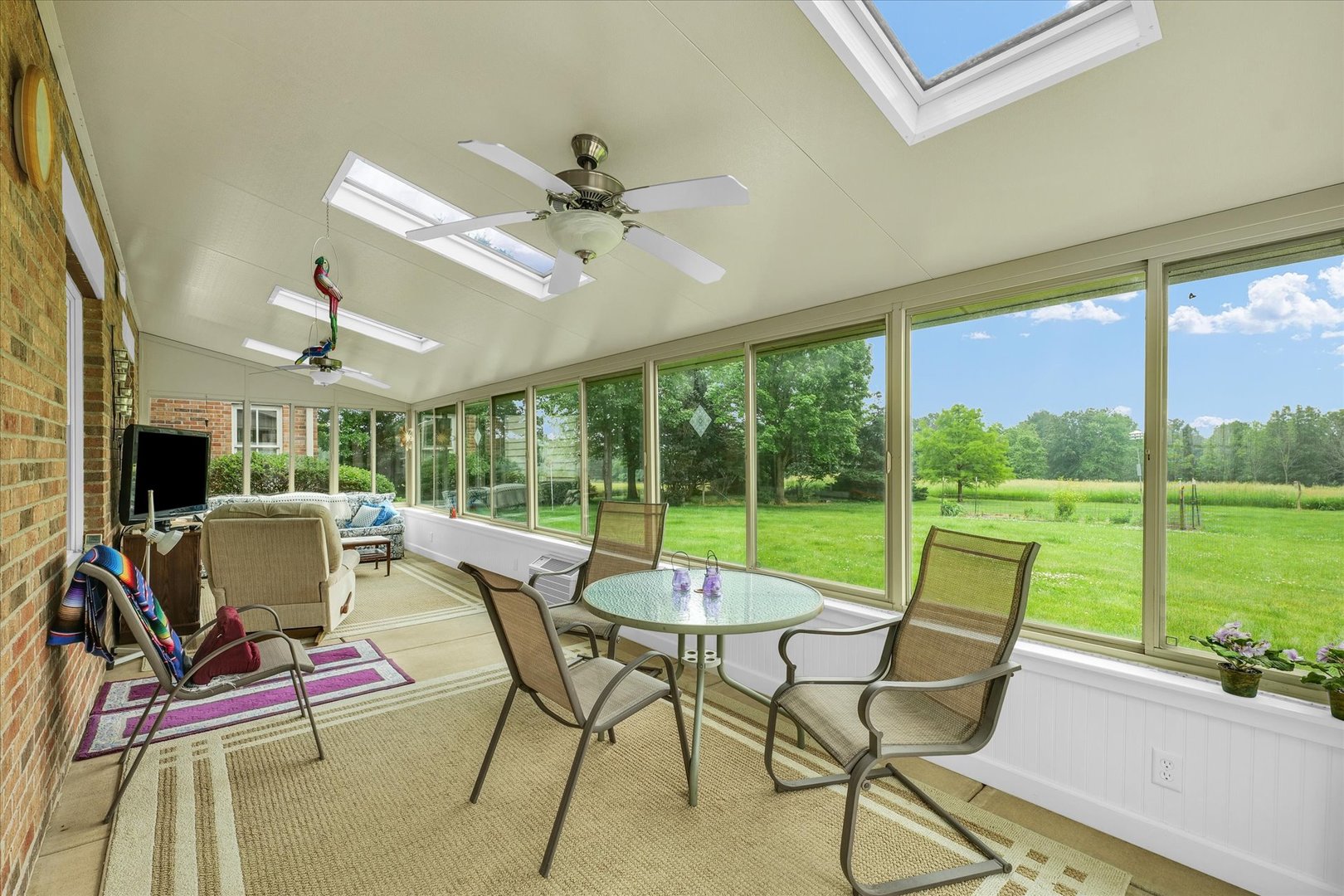647 County Farm Road Monticello, IL 61856 - Photo 17 of 74 a living room with patio furniture and a floor to ceiling window