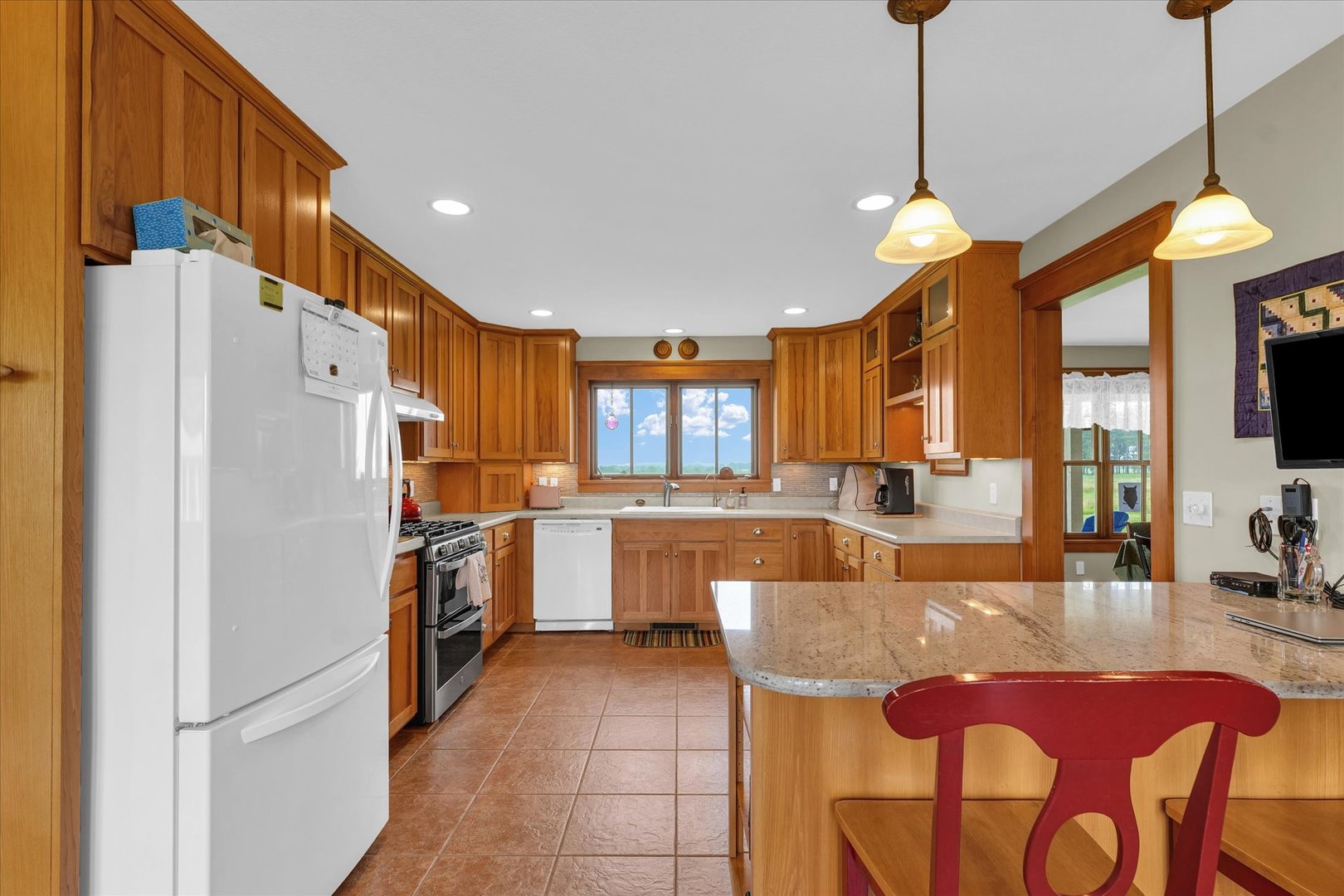 647 County Farm Road Monticello, IL 61856 - Photo 18 of 74 a kitchen with cabinets and refrigerator