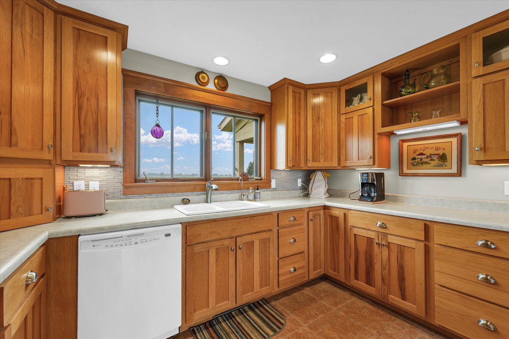 647 County Farm Road Monticello, IL 61856 - Photo 21 of 74 a kitchen with a sink window and cabinets