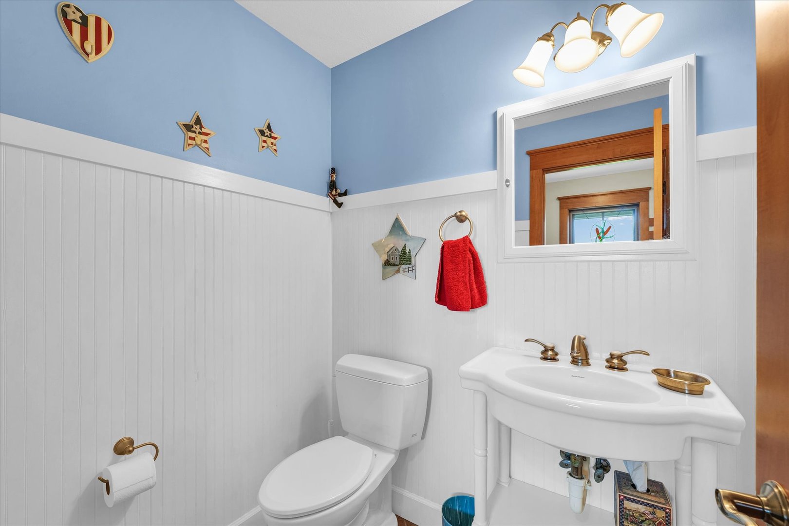 647 County Farm Road Monticello, IL 61856 - Photo 23 of 74 a bathroom with a toilet sink and mirror