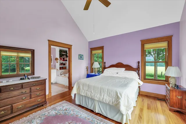 a view of a workspace with furniture and wooden floor