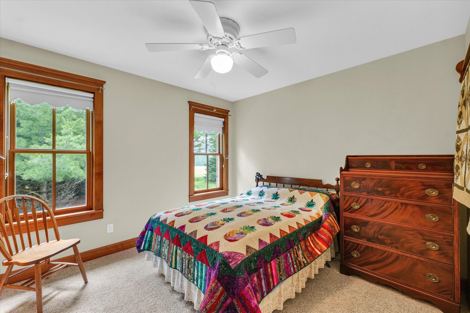 647 County Farm Road Monticello, IL 61856 - Photo 33 of 74 a bedroom with a bed and a chandelier