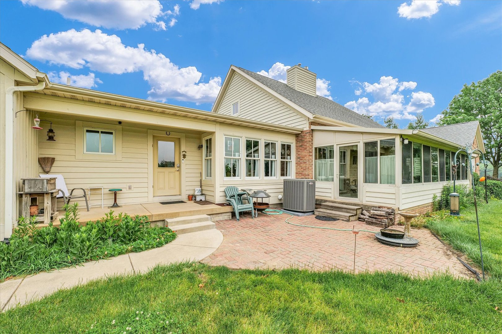 647 County Farm Road Monticello, IL 61856 - Photo 54 of 74 a front view of a house with swimming pool and sitting area