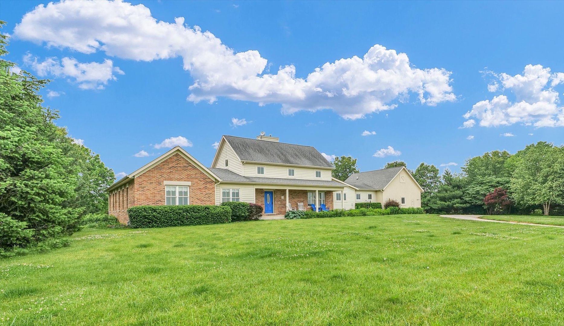 647 County Farm Road Monticello, IL 61856 - Photo 6 of 74 a front view of a house with garden