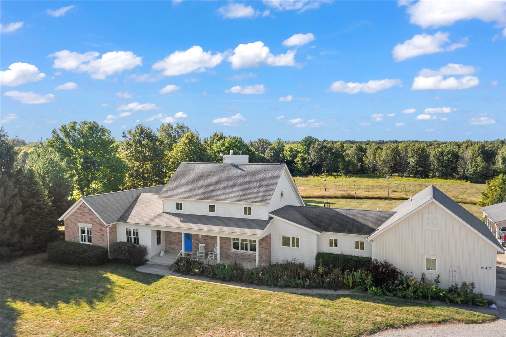 647 County Farm Road Monticello, IL 61856 - Photo 71 of 74 a view of a house with swimming pool and a yard