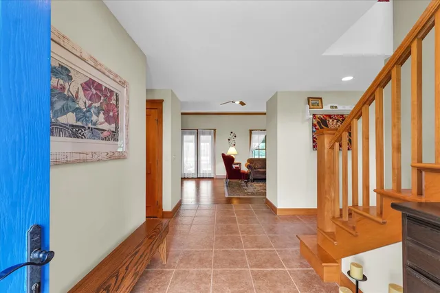 a living room with furniture a rug and a chandelier