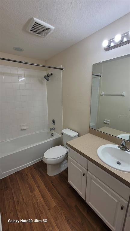 8814 Walnut Gable Court Riverview, FL 33578 - Photo 6 of 10 a bathroom with a granite countertop sink a toilet a mirror and shower