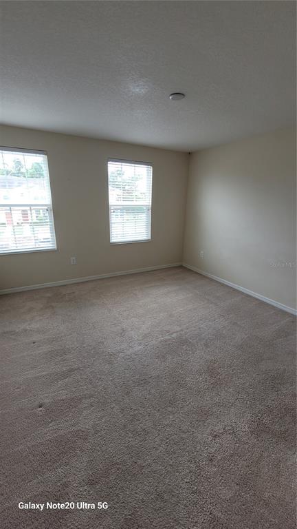 8814 Walnut Gable Court Riverview, FL 33578 - Photo 7 of 10 an empty room with windows