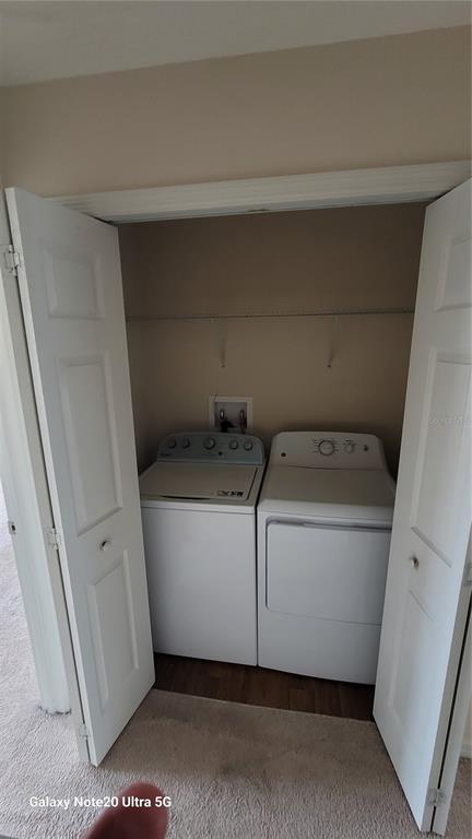 8814 Walnut Gable Court Riverview, FL 33578 - Photo 9 of 10 a utility room with dryer and washer