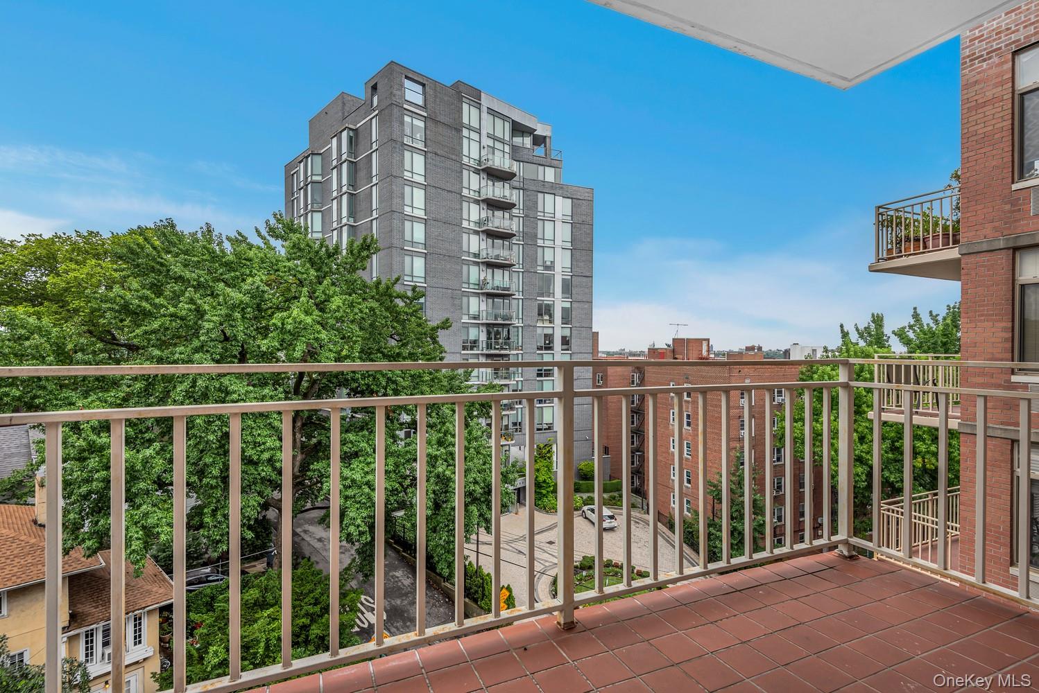 a view of balcony with a floor to ceiling window and wooden fence