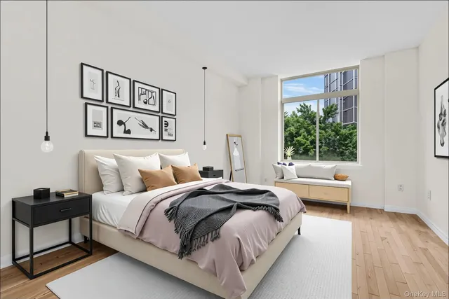 a bedroom with a bed and a couch