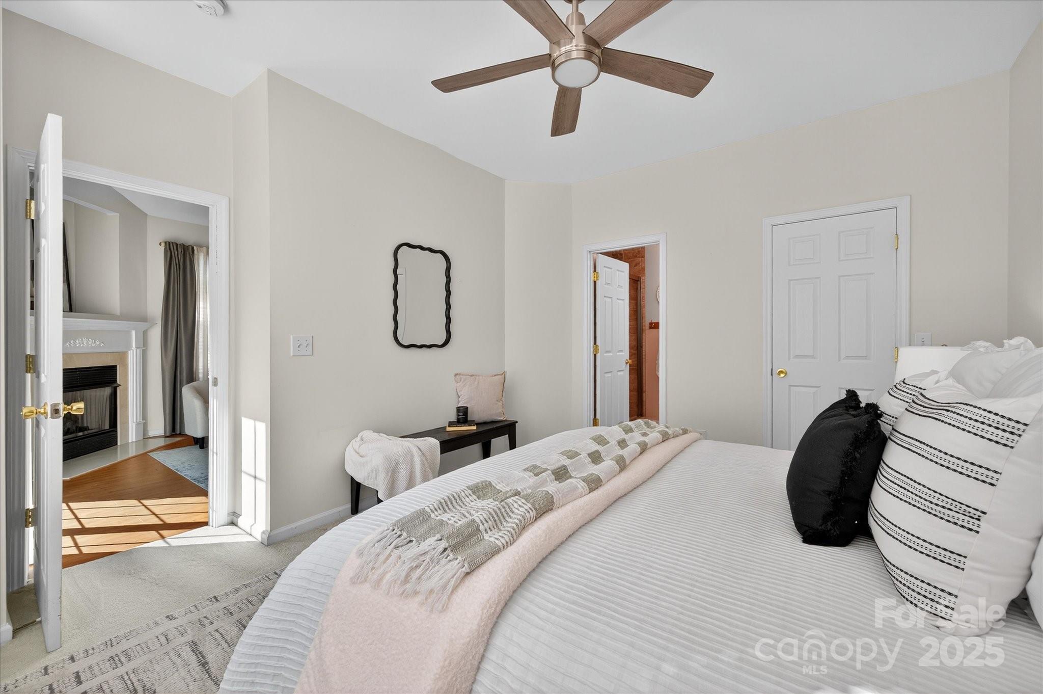 1119 Sienna Sand Way Fort Mill, SC 29708 - Photo 20 of 36 a bedroom with a bed and a mirror
