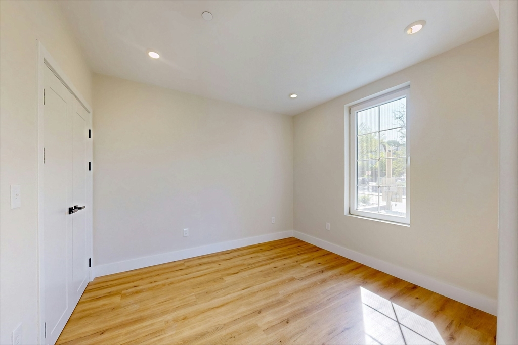 476 Warren Street Boston, MA 02121 - Photo 21 of 29 a view of a room that has a bed and a window